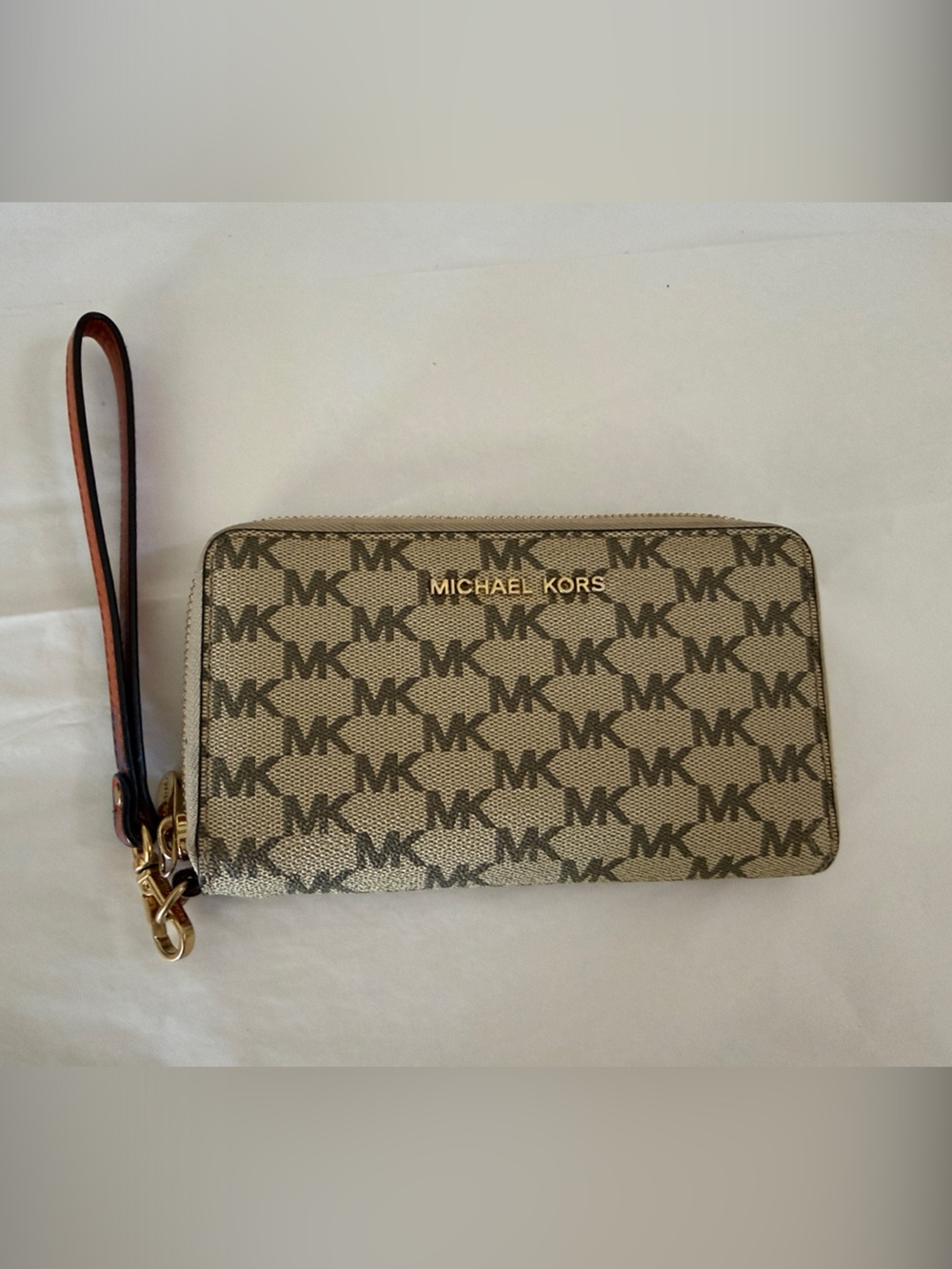 Priced to sell!!!Michael Kors Tan Logo Zip Wristlet with Gold Hardware